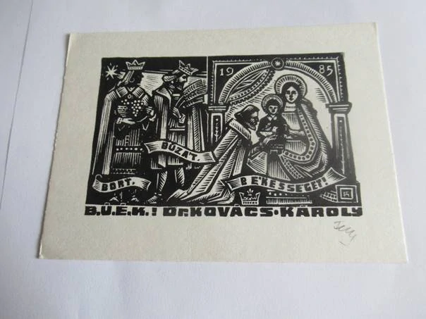 Původní sběratelská novoročenka B.Ú.É.K. 1985 Dr. Kovács Károly – autor Antal Féry, dřevoryt X2 (14 × 10,5 cm)