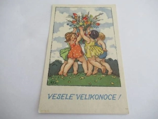 Děti s květinami na trávě