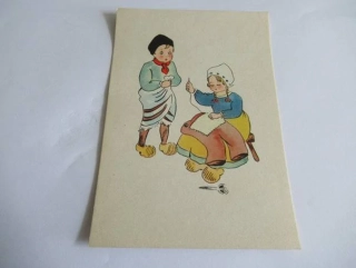Chlapec a dívka zašívající kalhoty